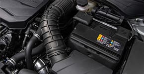 A top view of the battery inside of a Kia vehicle.